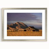 Textured art print of an abstract South Dakota landscape in muted earth tones on a framed silver mat.