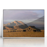 Acrylic print of South Dakota landscape in art deco style, with muted earth tones, framed in white.