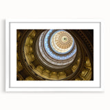 Abstract art print of Austin skyline in muted blue and gray tones, framed with a white mat, suitable for dining room decor.