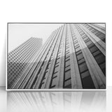 Art deco poster of Houston skyline in muted gray and blue tones on framed acrylic.