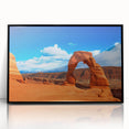 Large abstract wall art depicting the Arches National Park in Utah, rendered in earth tones on a black framed acrylic.