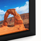 Close-up of a black framed canvas featuring a textured depiction of Arches National Park in vibrant colors.