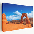 Arches National Park landscape on large stretched canvas, featuring red rock formations under a blue sky.