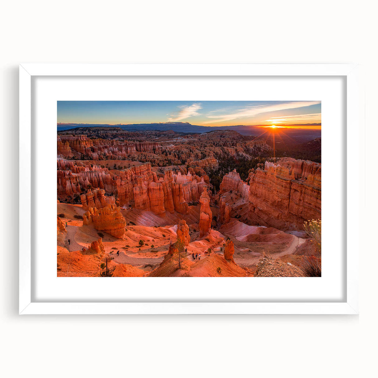 Abstract art print of Bryce Canyon in earthy red and orange tones, framed with a white mat, suitable for dining room decor.