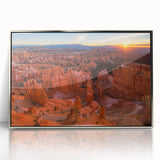 Mid-century modernist art depicting Bryce Canyon with orange and red rock formations on a silver-framed acrylic print.