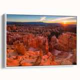 Vintage poster art of Bryce Canyon on a white framed canvas, featuring earthy red and orange tones.