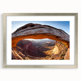 Textured art print of Canyonlands with abstract red and orange tones on a framed silver mat, suitable for bedroom decor.