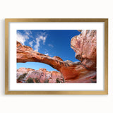 Extra large abstract art print depicting Utah's Capitol Reef in textured shades, framed in gold, ideal for living room decor.