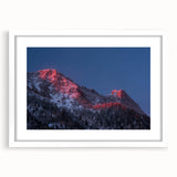 Abstract art print of Salt Lake City with vibrant blue and orange hues on a white framed canvas, ideal for dining room decor.