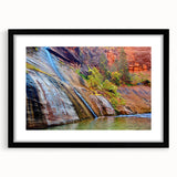Colorful abstract art print of Zion landscape in vibrant hues, framed in black, ideal for living room decor.