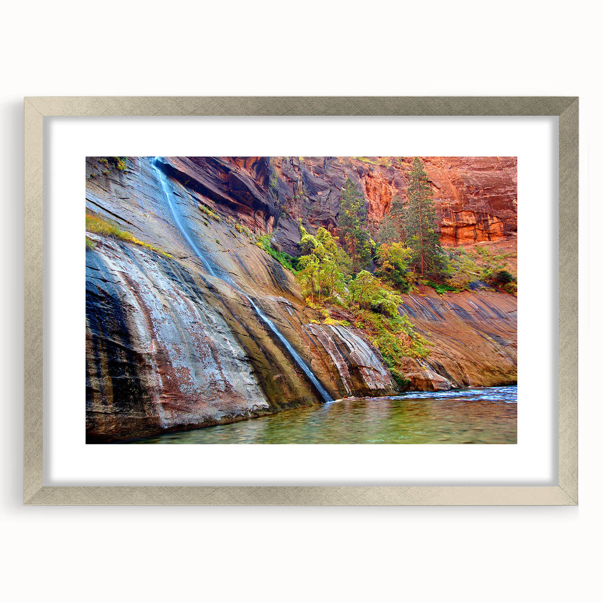 Textured art print of Zion National Park in earth tones, framed in silver, suitable for bedroom decor.