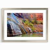 Textured art print of Zion National Park in earth tones, framed in silver, suitable for bedroom decor.
