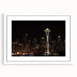 Abstract art print of Seattle skyline in muted blue and gray tones on a framed white mat, ideal for dining room decor.