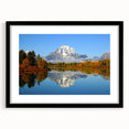 Colorful abstract art print of Wyoming's Grand Tetons in vibrant hues on a large framed canvas.