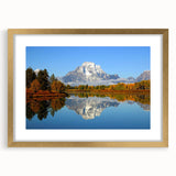Extra large wall art featuring an abstract print of the Grand Tetons in textured colors of blue and gray, framed in gold.