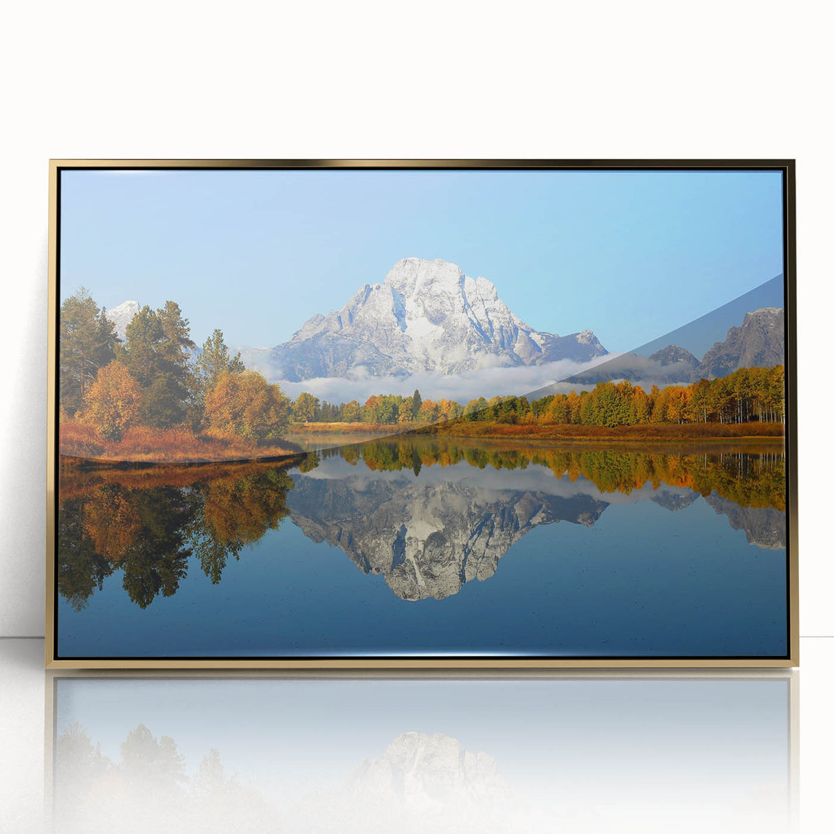 Large acrylic print featuring the Grand Tetons under a clear sky, framed in gold, ideal for modern art wall decor.