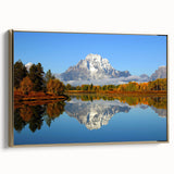 Framed canvas wall art depicting the Grand Tetons in vintage poster style with muted earth tones, ideal for bedroom decor.
