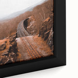 Close-up of a textured, extra large black wall art canvas depicting colorful autumn leaves, ideal for living room decor.