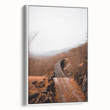 Vintage poster art depicting autumn scenery on a framed canvas, featuring warm red and orange tones.