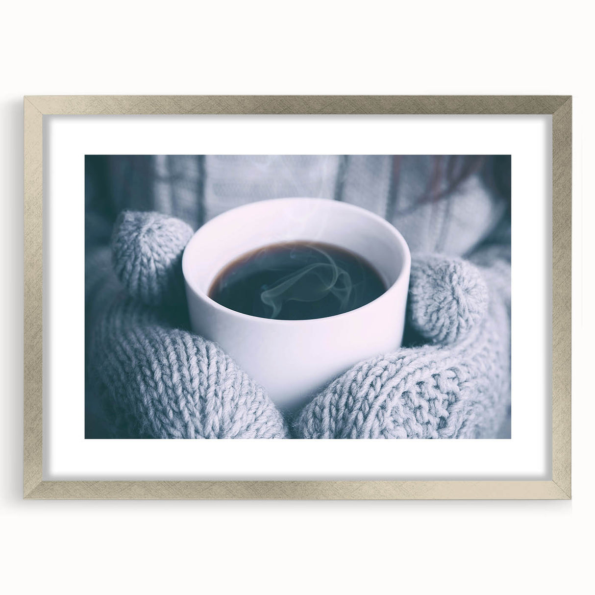 Textured art depicting a winter scene in muted blue and white tones on a framed silver canvas, suitable for bedroom decor.