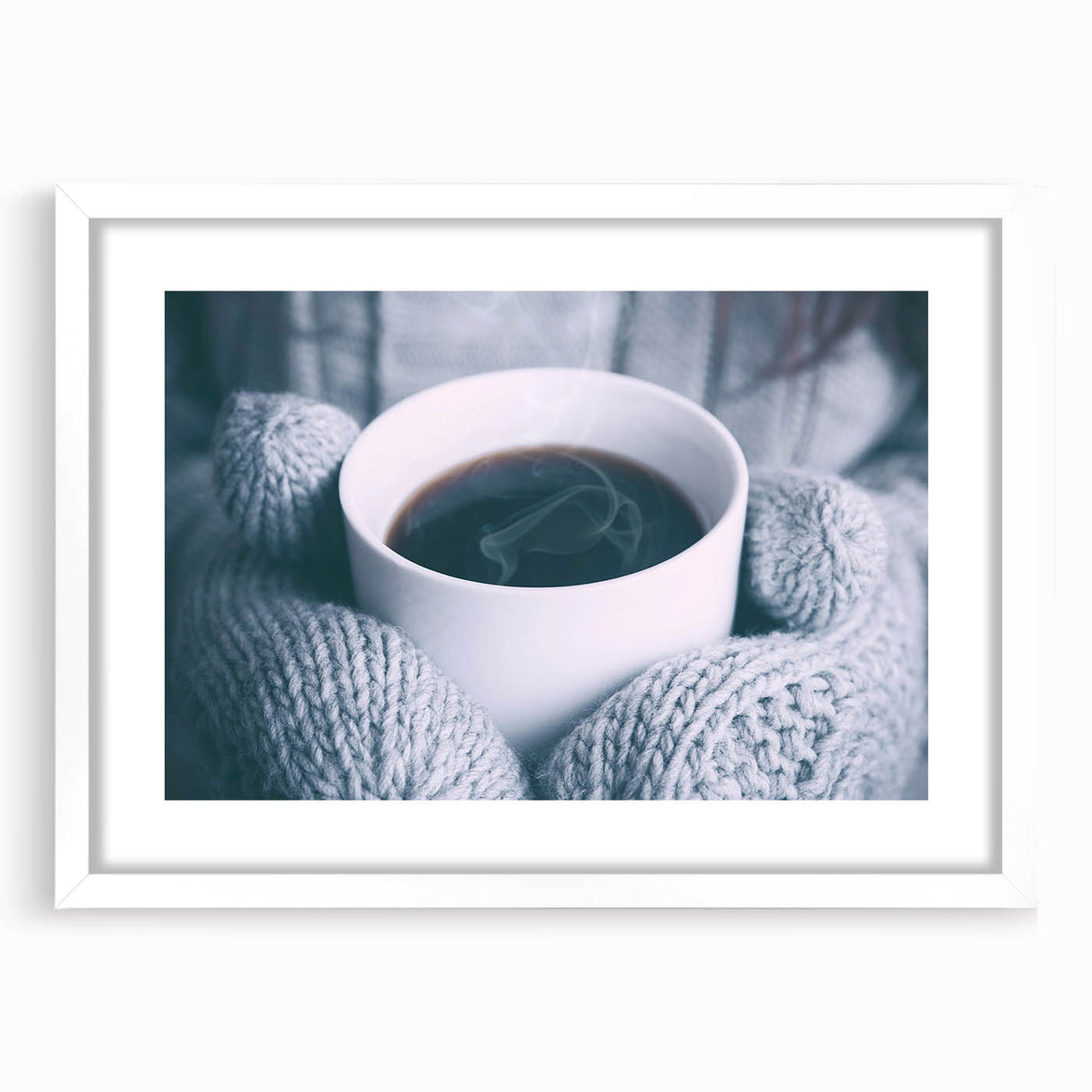 Abstract art print depicting a winter scene in muted blue and white tones on a framed canvas.