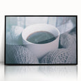 Large abstract wall art featuring swirling blue and white patterns on a black acrylic framed print.