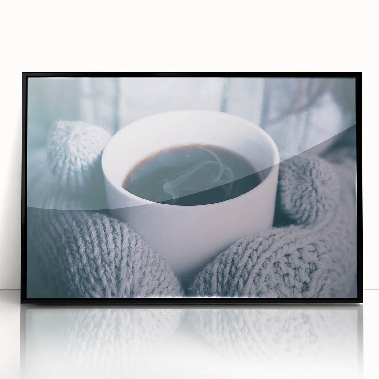 Large abstract wall art featuring swirling blue and white patterns on a black acrylic framed print.