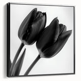 Framed canvas artwork showcasing a vibrant floral and botanical design with a sleek black border, perfect for home decor or office space enhancement. Ideal for nature lovers seeking stylish wall art.