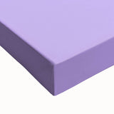 Close-up of a large art piece featuring a black and white landscape painting of fruits on a stretched canvas.