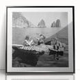 Large abstract wall art featuring silhouetted figures and food motifs in black and white, framed in acrylic.