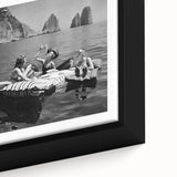 Close-up of black wall art featuring colorful, textured depiction of people dining, on a framed canvas.