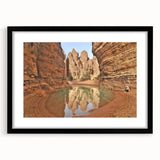 Abstract art print of colorful, textured scenery resembling Algeria in a large black frame, ideal for living room decor.