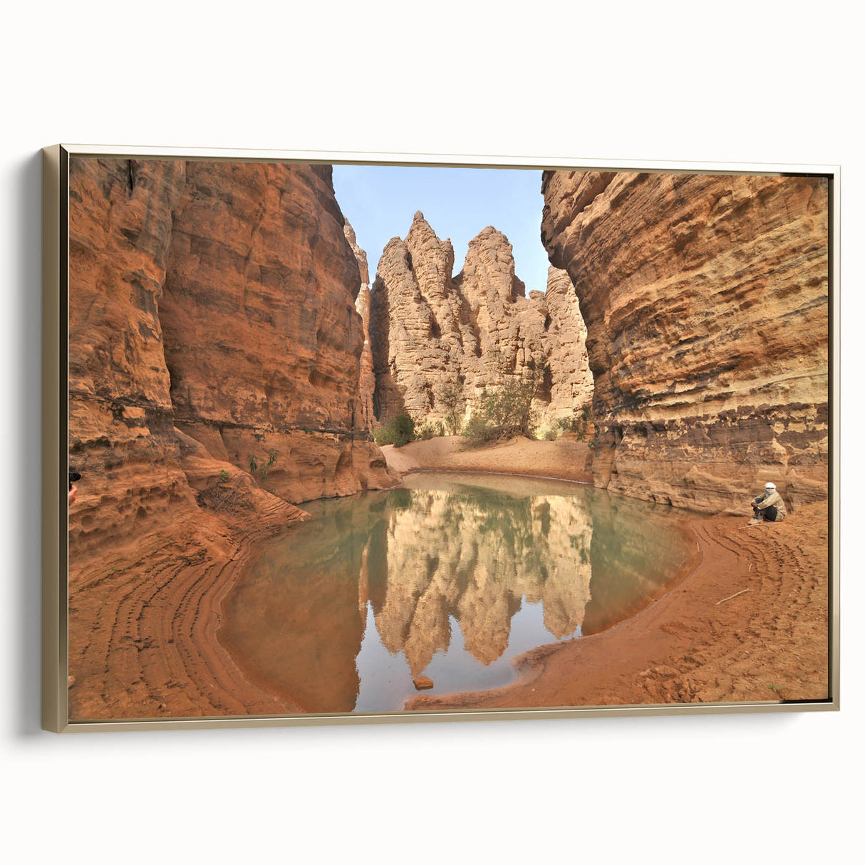 Framed canvas featuring a vintage-style landscape painting of an Algerian scenery in gold, black, and colorful tones.
