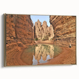 Framed canvas featuring a vintage-style landscape painting of an Algerian scenery in gold, black, and colorful tones.