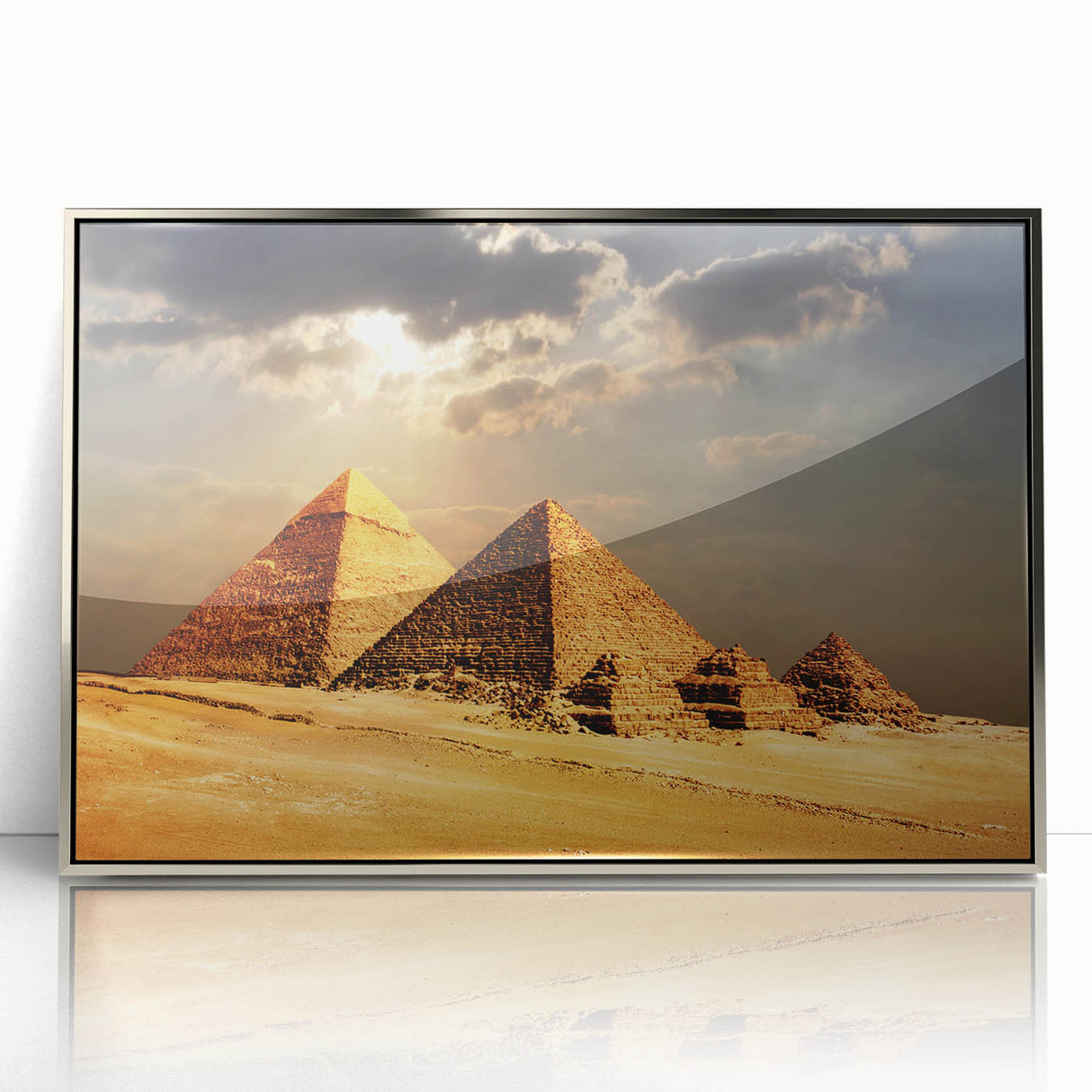 Modern art wall decor featuring a silver-framed acrylic print of an Egyptian landscape in muted earth tones.