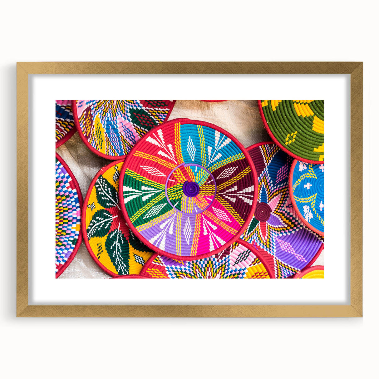 Textured abstract art print of Ethiopian scenery in gold frame, with earthy color tones, suitable for bedroom decor.