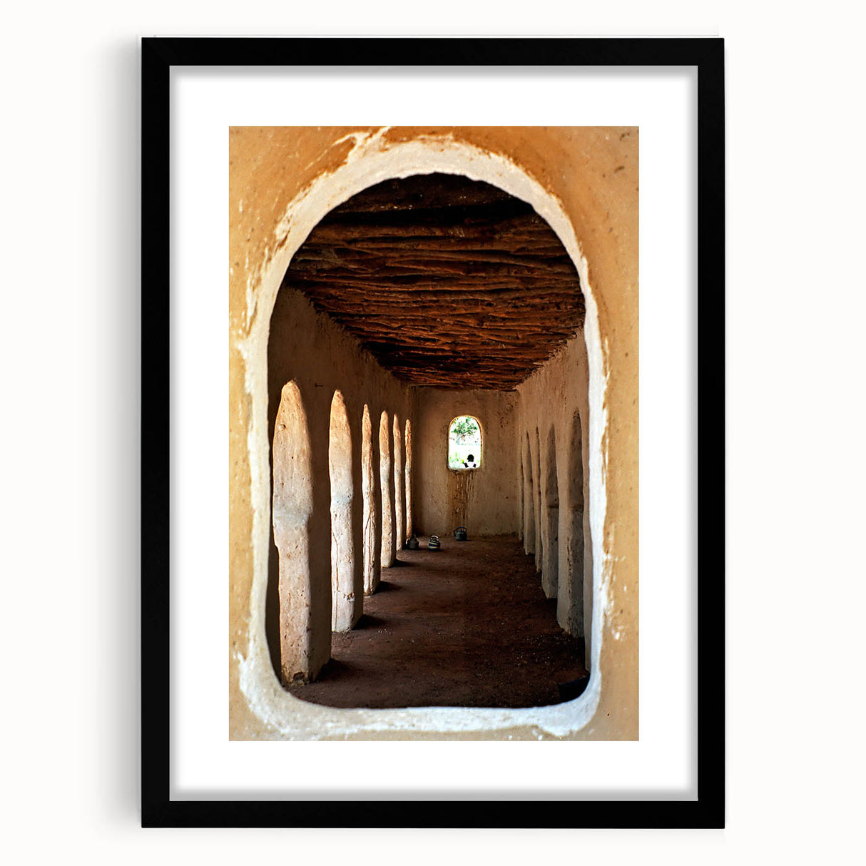 Abstract art print depicting vibrant, textured African scenery on a large canvas, framed in black.