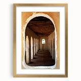 Textured abstract art print of an African scenery in muted earth tones on a gold-framed canvas, suitable for bedroom art.