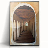 Large abstract wall art depicting an African Mali scenery in muted earth tones on a framed acrylic.