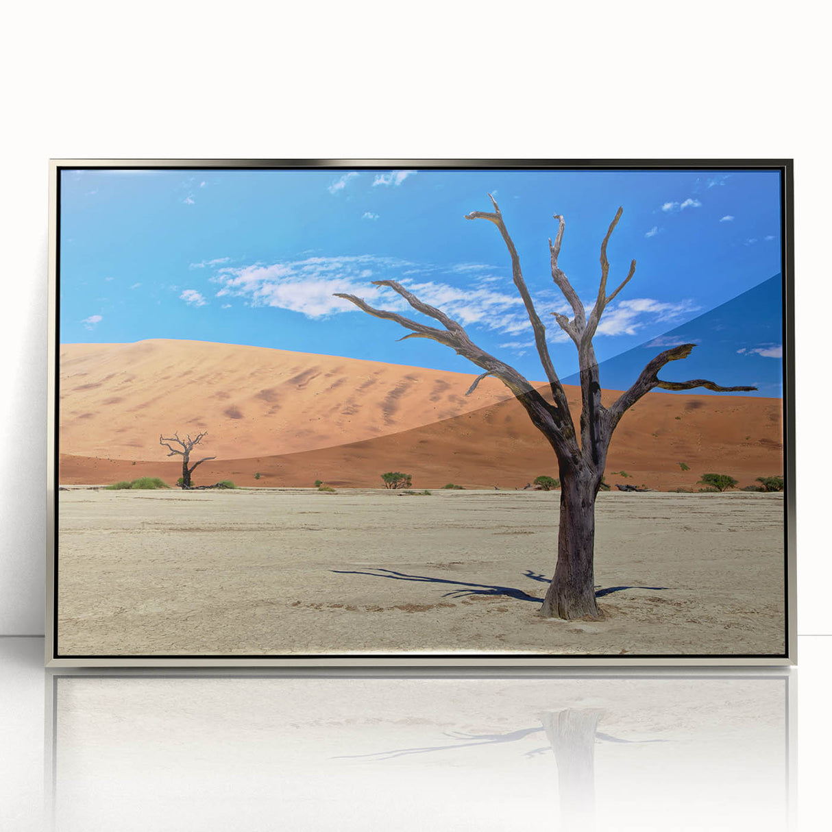 Acrylic print of an African scenery with a silver frame, featuring warm earth tones, ideal for modern art wall decor.