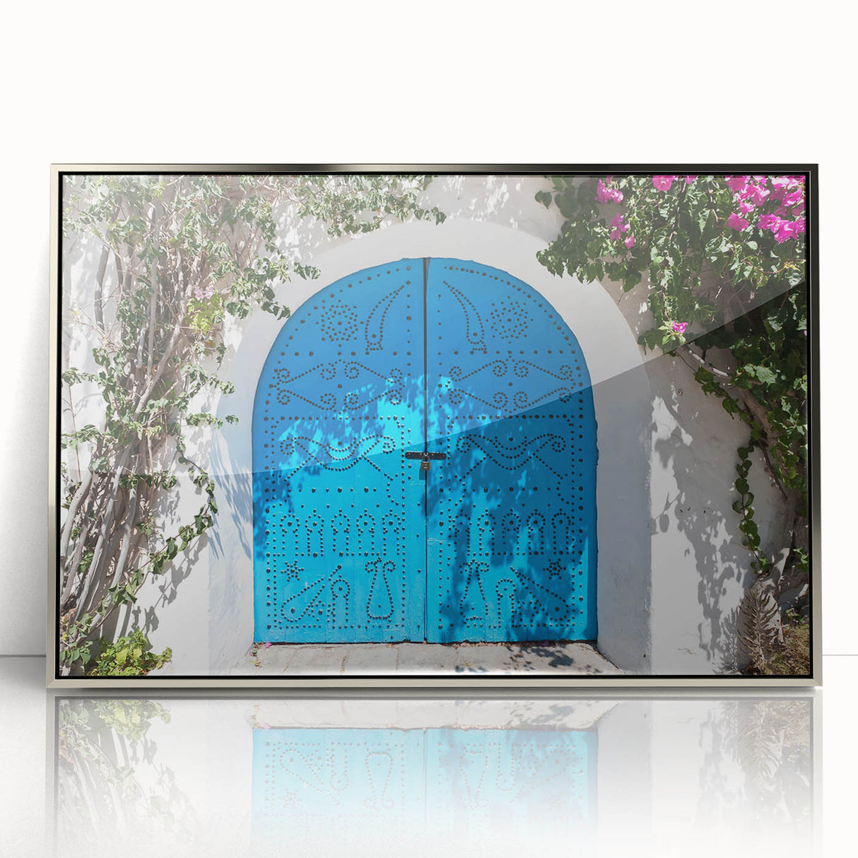 Mid-century modernist art depicting a Tunisian landscape in muted earth tones, framed in silver acrylic.