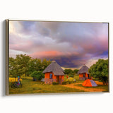 Framed canvas featuring a vintage-style landscape painting of an African savannah in muted gold and black tones.