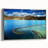 Framed canvas depicting a Tibetan landscape with colorful art in vintage poster style.