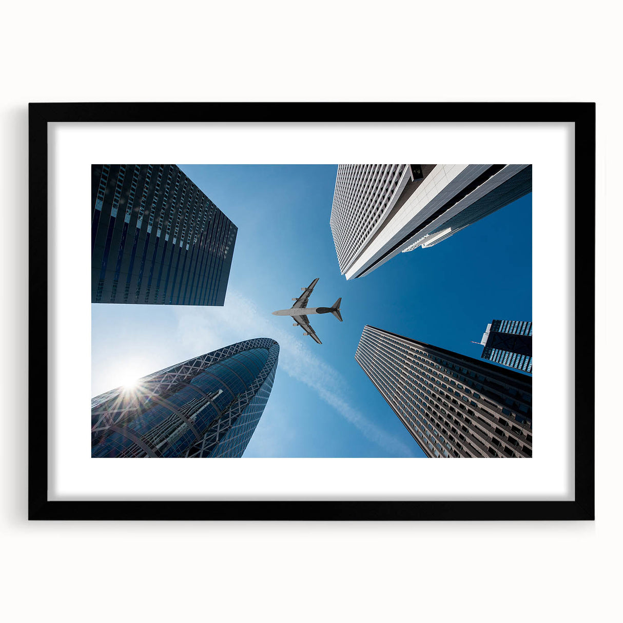Extra large abstract art print of a colorful Tokyo cityscape on textured canvas, framed in black.