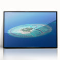 Large abstract wall art depicting a serene Maldivian landscape in muted blue and green tones, framed in black acrylic.
