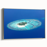 Framed canvas landscape art painting depicting the serene Maldives with vibrant blue waters and lush greenery.