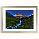 Textured art print depicting abstract mountain scenery in muted gray and blue tones, framed with a silver mat.