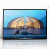 Large abstract wall art depicting a mid-century modernist scene in muted earth tones, framed in black acrylic.