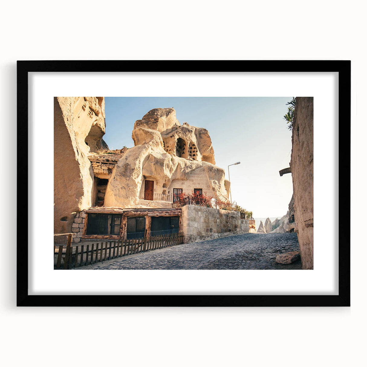 Extra large abstract art print featuring colorful, textured scenery of a Turkish landscape on a black-framed canvas.