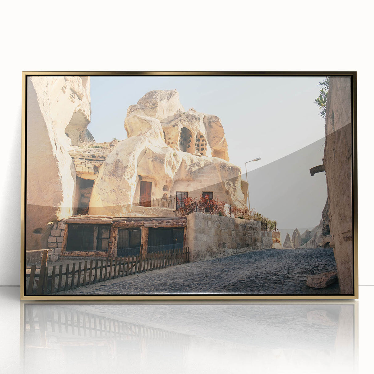 Large art print of a Turkish landscape in gold and blue tones on acrylic, framed, in mid-century modernist style.